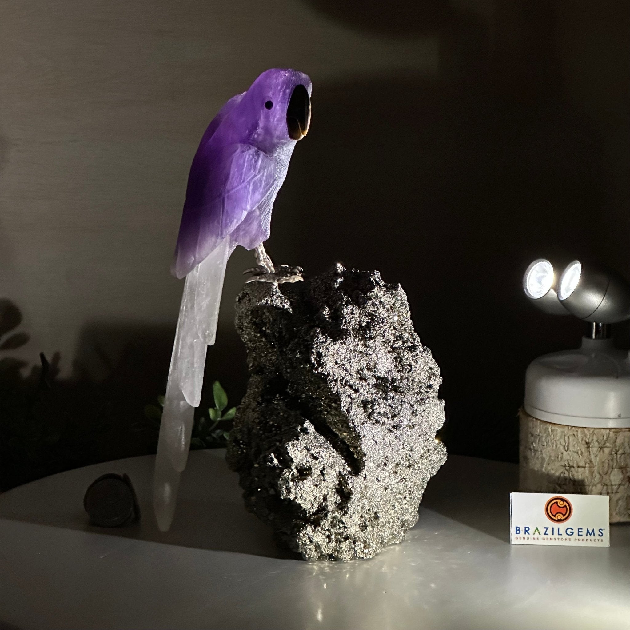 Large Hand - Carved Amethyst Parrot 9.1" Long on a Pyrite Cluster #3005 - AMPPY - 051 - Brazil GemsBrazil GemsLarge Hand - Carved Amethyst Parrot 9.1" Long on a Pyrite Cluster #3005 - AMPPY - 051Crystal Birds3005 - AMPPY - 051