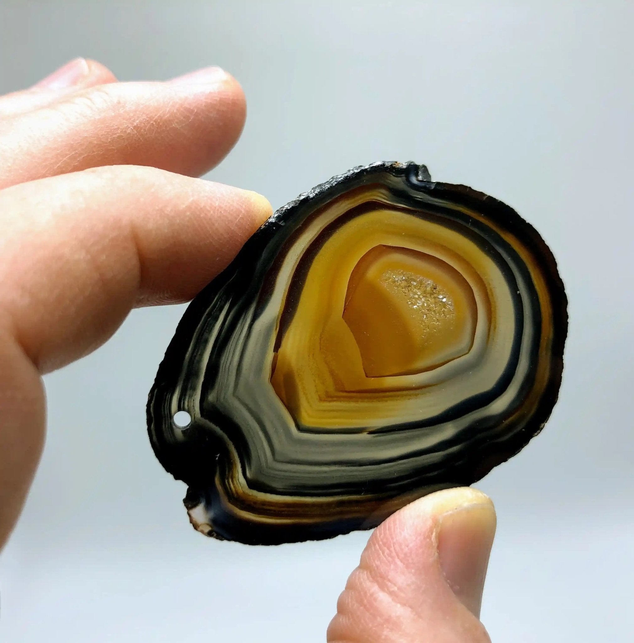 Polished Natural Agate slices w/ top drilled pendant hole, 10 slices Model #5051NAHL - Brazil GemsBrazil GemsPolished Natural Agate slices w/ top drilled pendant hole, 10 slices Model #5051NAHLSlices for Crafts5051NAHL