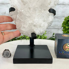 Super Quality Clear Quartz Crystal Cluster, metal base, 8.4 lbs & 11.1" Tall #5495-0077 by Brazil Gems® - Brazil GemsBrazil GemsSuper Quality Clear Quartz Crystal Cluster, metal base, 8.4 lbs & 11.1" Tall #5495-0077 by Brazil Gems®Clusters on Fixed Bases5495-0077