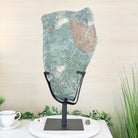 Decorative stone on a stand with a cup and saucer in the background