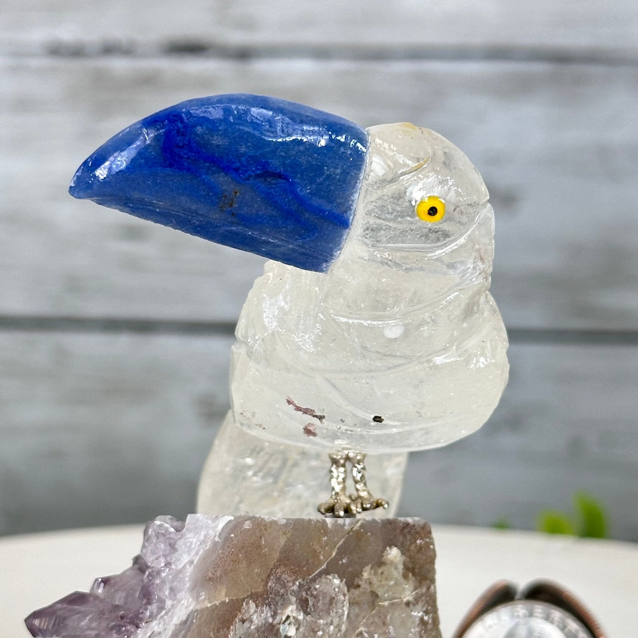 Small Hand - Carved Clear Quartz Toucan on an Amethyst Base #3002 - CQTAM - 031 - Brazil GemsBrazil GemsSmall Hand - Carved Clear Quartz Toucan on an Amethyst Base #3002 - CQTAM - 031Crystal Birds3002 - CQTAM - 031