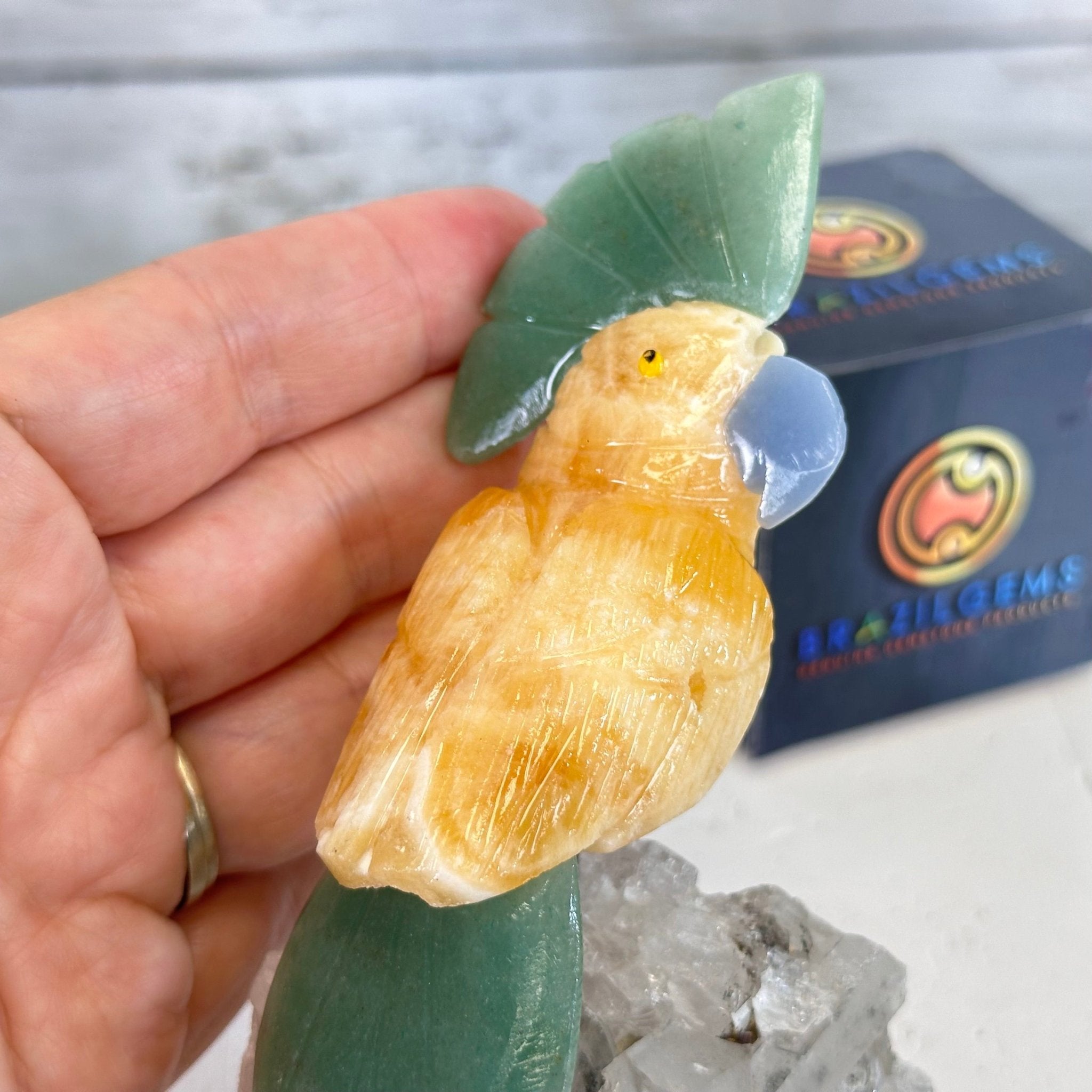 Small Hand - Carved Orange Calcite Cockatoo on a Clear Quartz Base #3002 - ORCCQ - 019 - Brazil GemsBrazil GemsSmall Hand - Carved Orange Calcite Cockatoo on a Clear Quartz Base #3002 - ORCCQ - 019Crystal Birds3002 - ORCCQ - 019