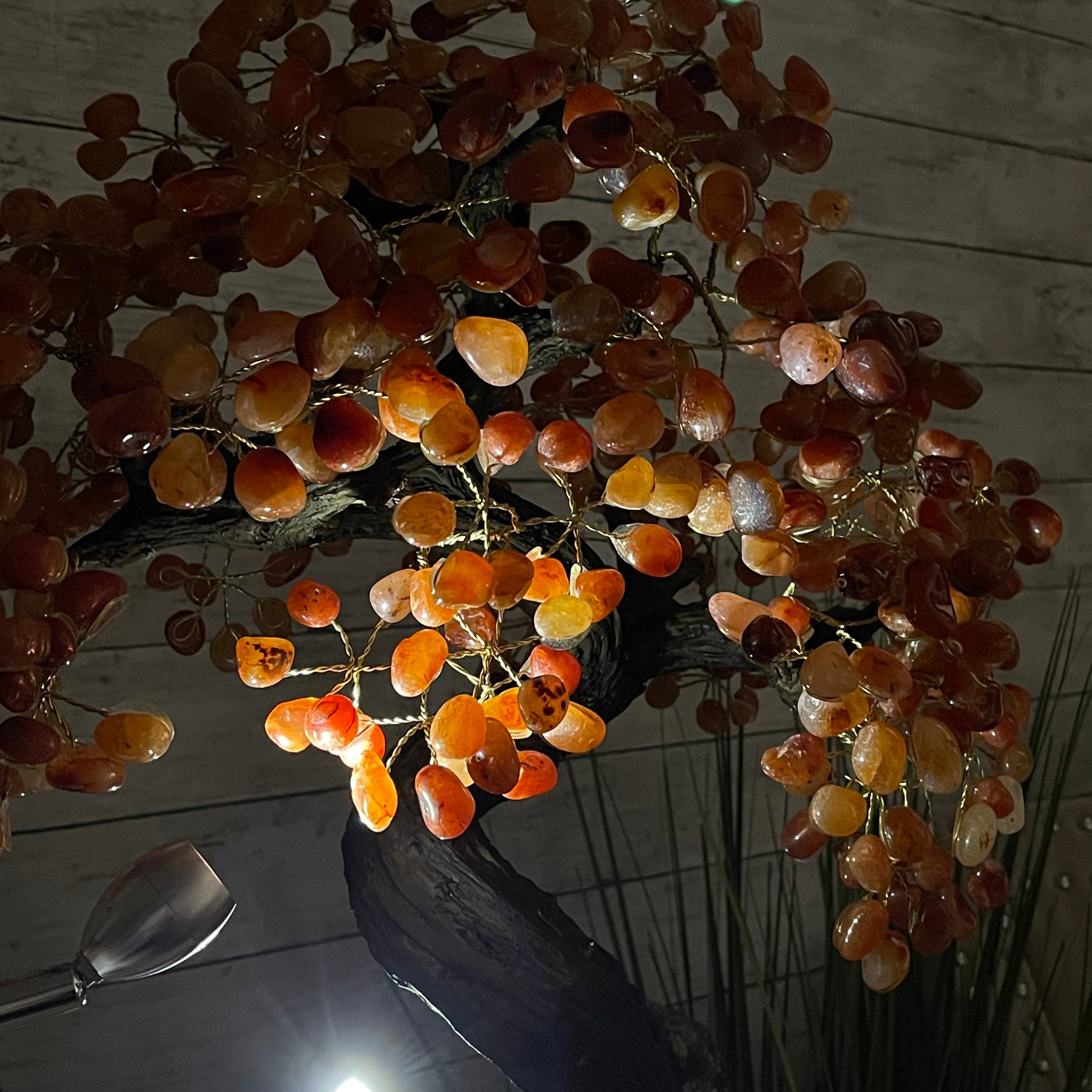 A handmade Carnelian gemstone tree resembling a bonsai tree with orange gemstones