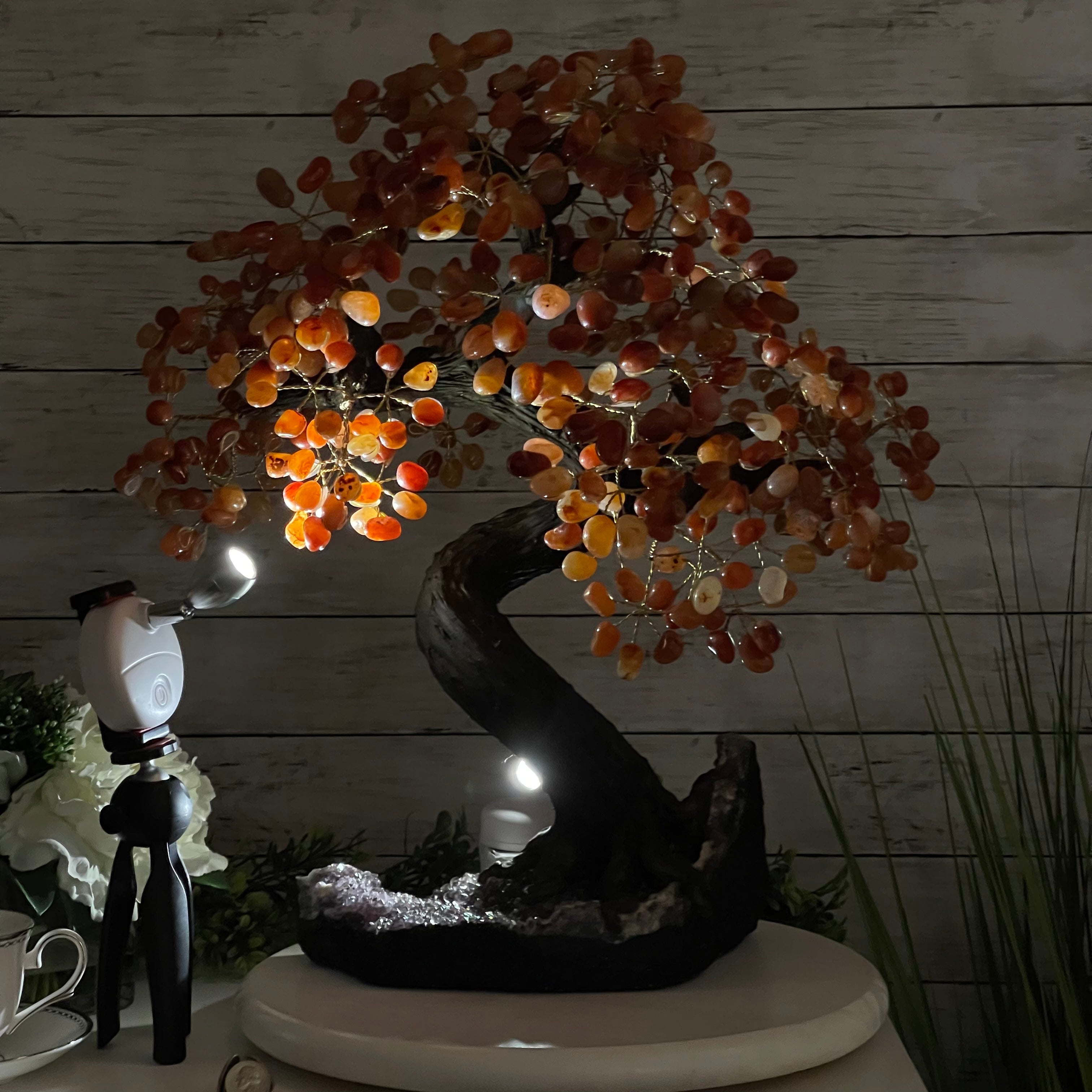 Carnelian Gemstone Tree with orange gemstone leaves under light
